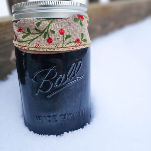 eldeberry syrup mason jar in snow